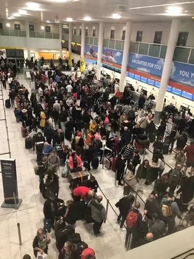 Travellers crowd the airport following the closure of the runway at Gatwick.