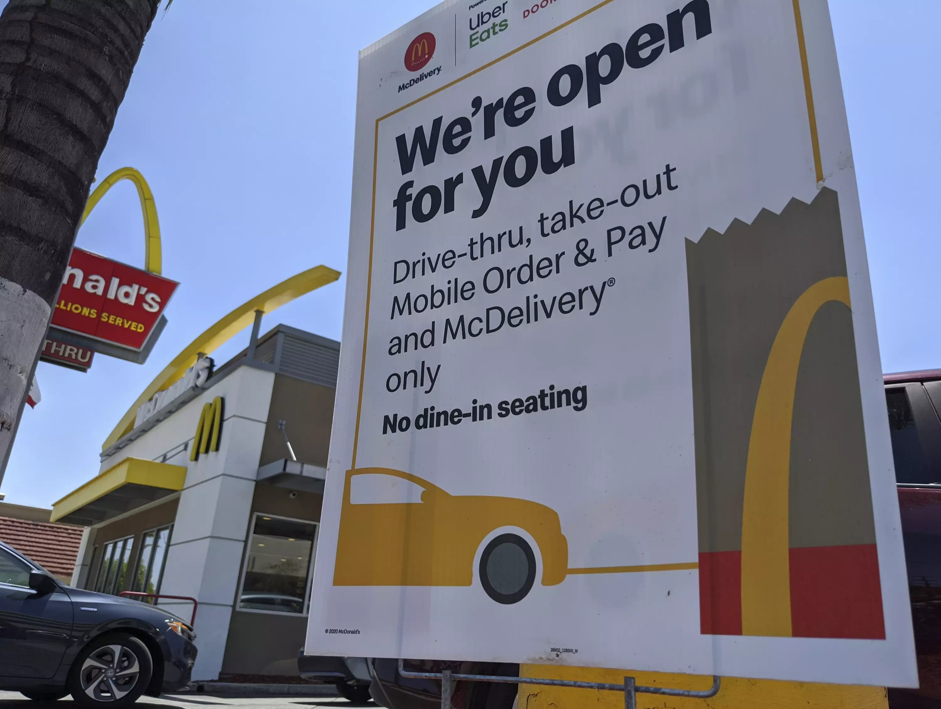 McDonald's has opened some of its UK restaurants for drive-thru and delivery.