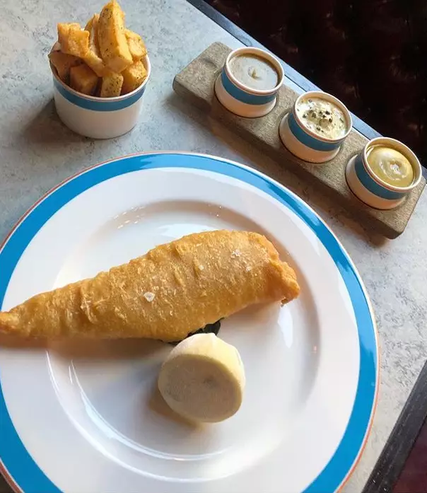 The fish and chips come with three sauces.