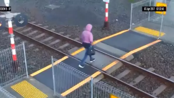 Woman Avoids Getting Hit By A Train Within Inches In Shocking Footage