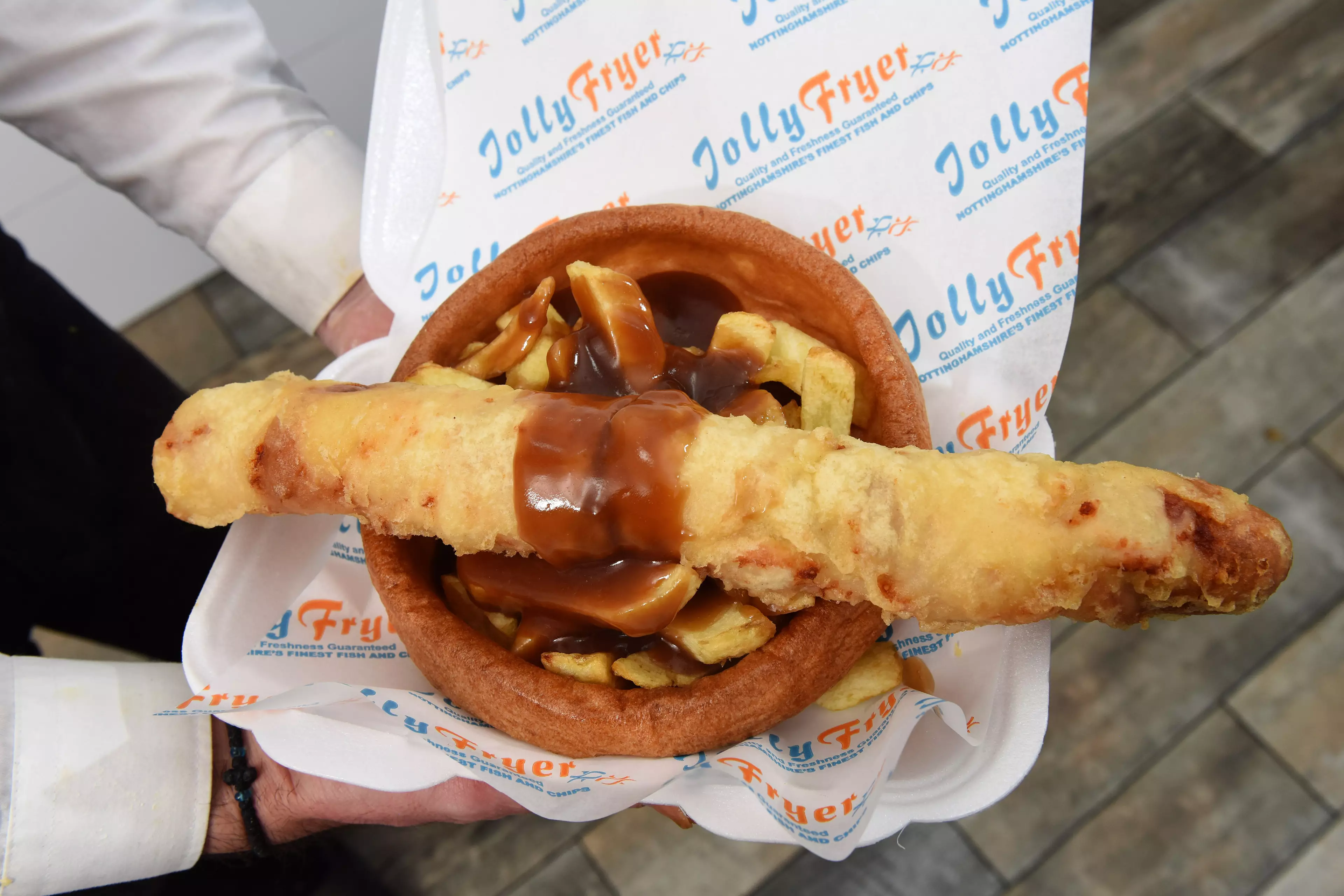 The foot-long sausage is also served with a giant Yorkshire pudding, chips and gravy (