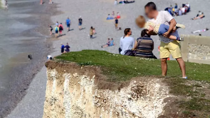 Man Dangles Child Over 400ft Drop At Notoriously Dangerous Cliff Edge