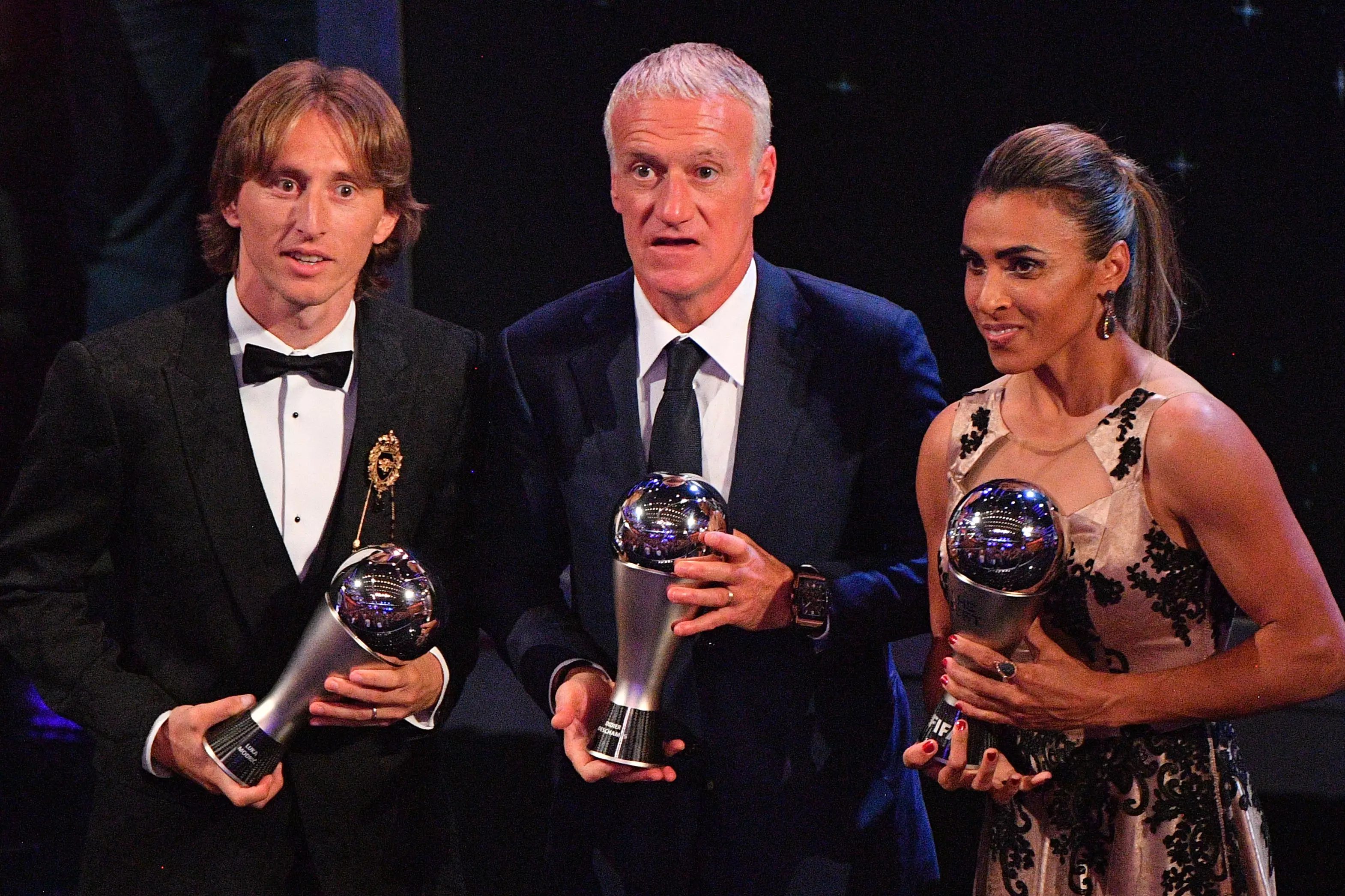Modric with Didier Deschamps and Marta, who won Best Manager and Best Female Player Awards respectively. Image: PA Images