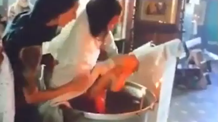 Footage Shows 'Sadistic' Priest Violently Baptising Baby 