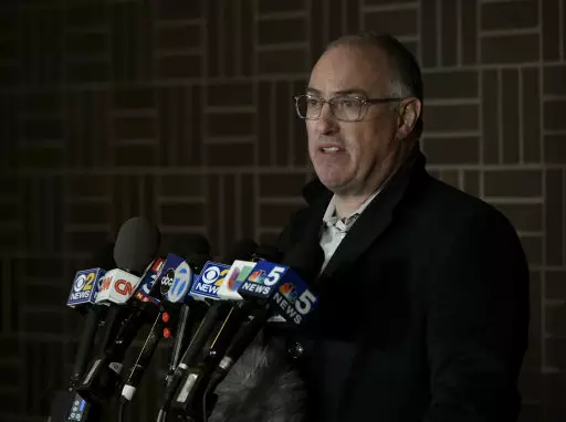 Singer R. Kelly's attorney Steve Greenberg speaks to the media after Kelly turned himself in to police Friday.