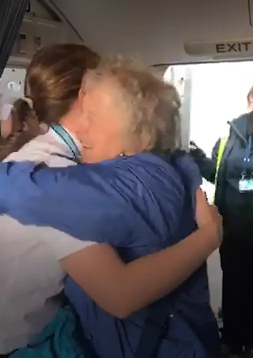 Laura waited to surprise her grandparents on the plane.