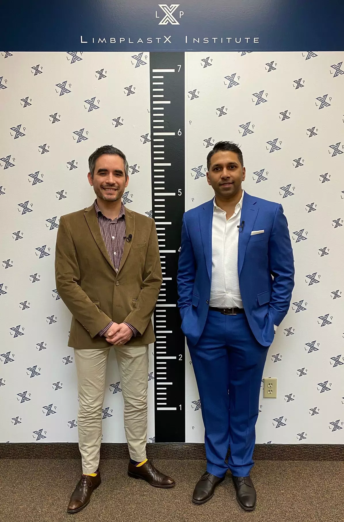 Patient Irving Rodríguez (left) after the stretching surgery, standing almost three inches taller alongside Dr Debiparshad (right).