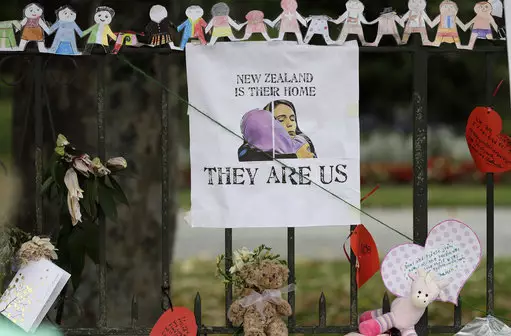 A poster featuring a drawing of Prime Minister Jacinda Ardern hangs on a wall at the Botanical Gardens in Christchurch, New Zealand.