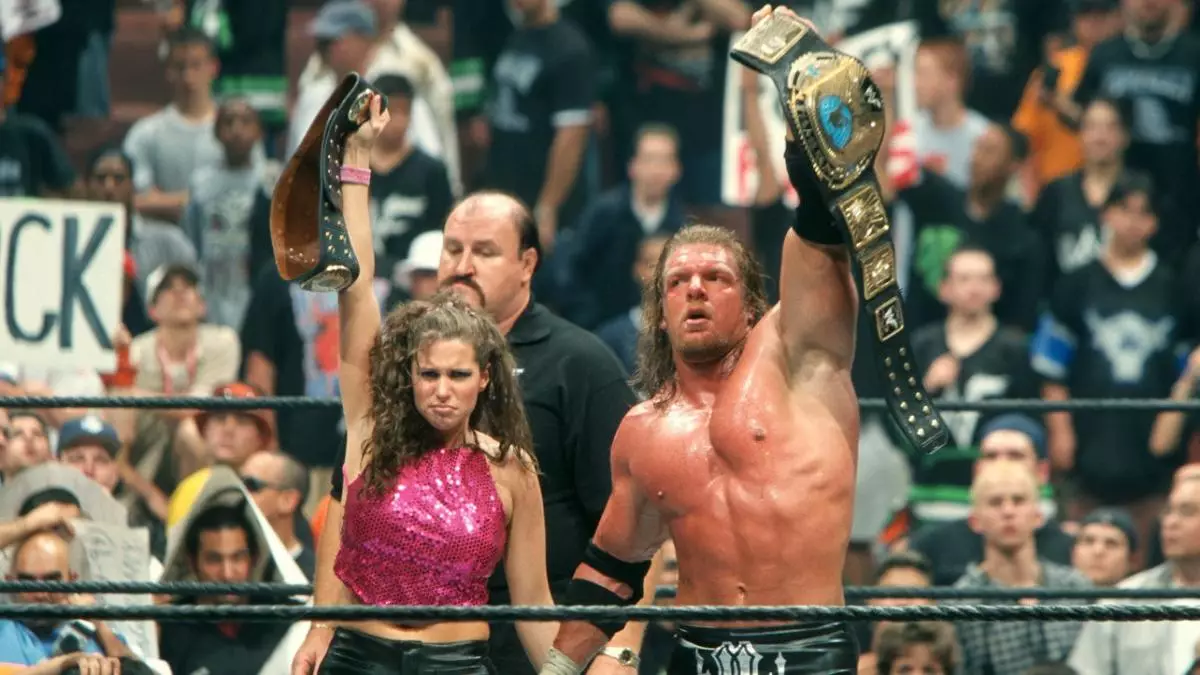 Alongside her then on screen husband Triple H, the first incarnation of the 'authority'. Image: WWE.
