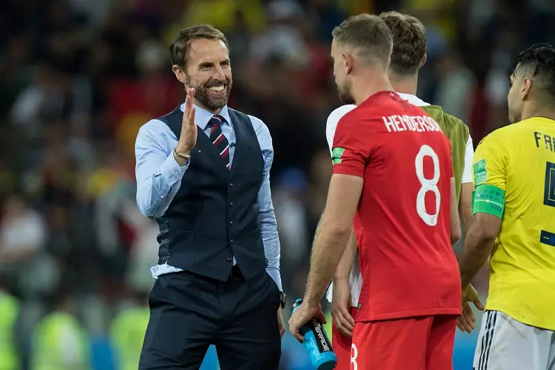 Gareth Southgate congratulates Jordan Henderson following victory over Sweden.