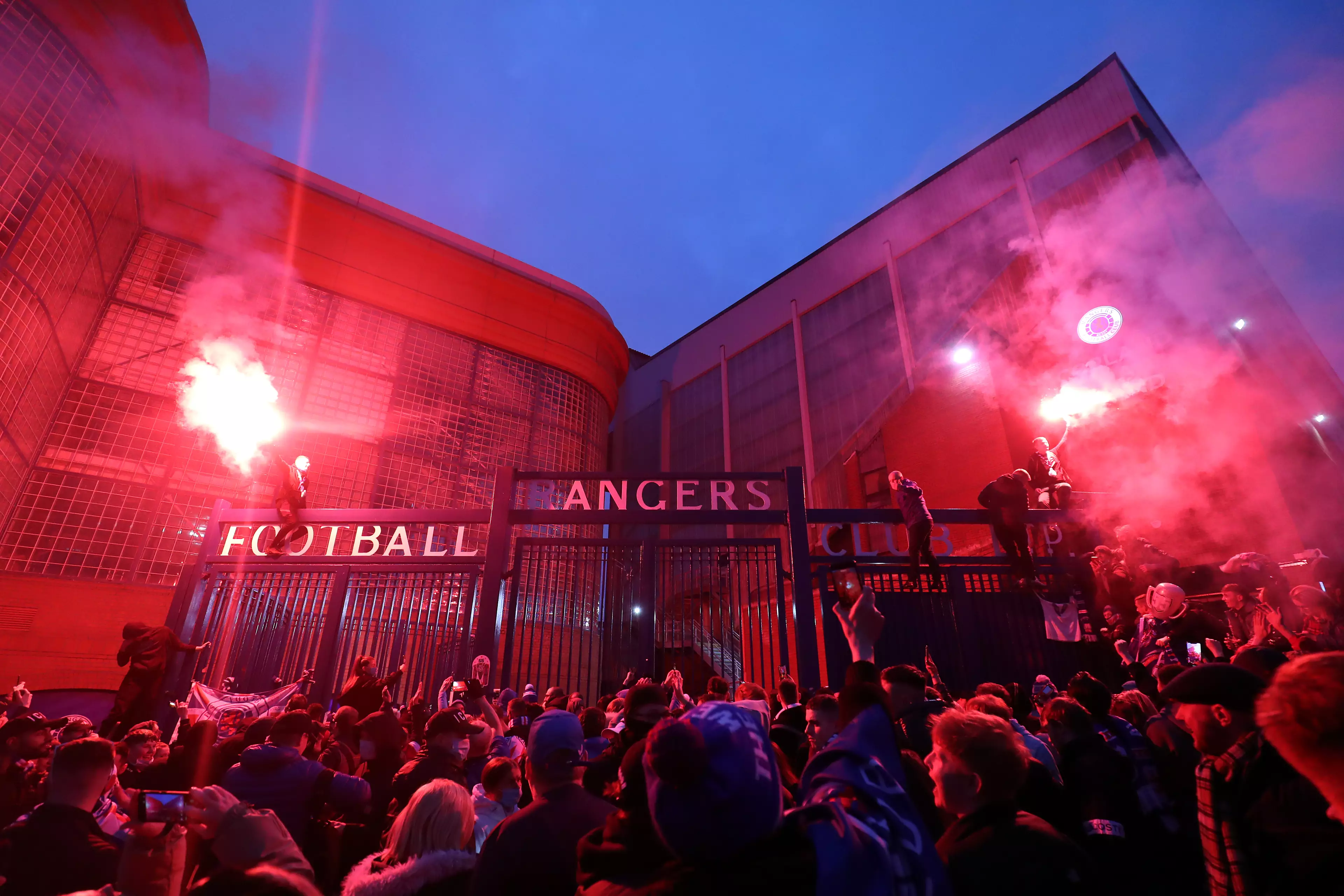 Rangers fans celebrate outside Ibrox. Image: PA Images