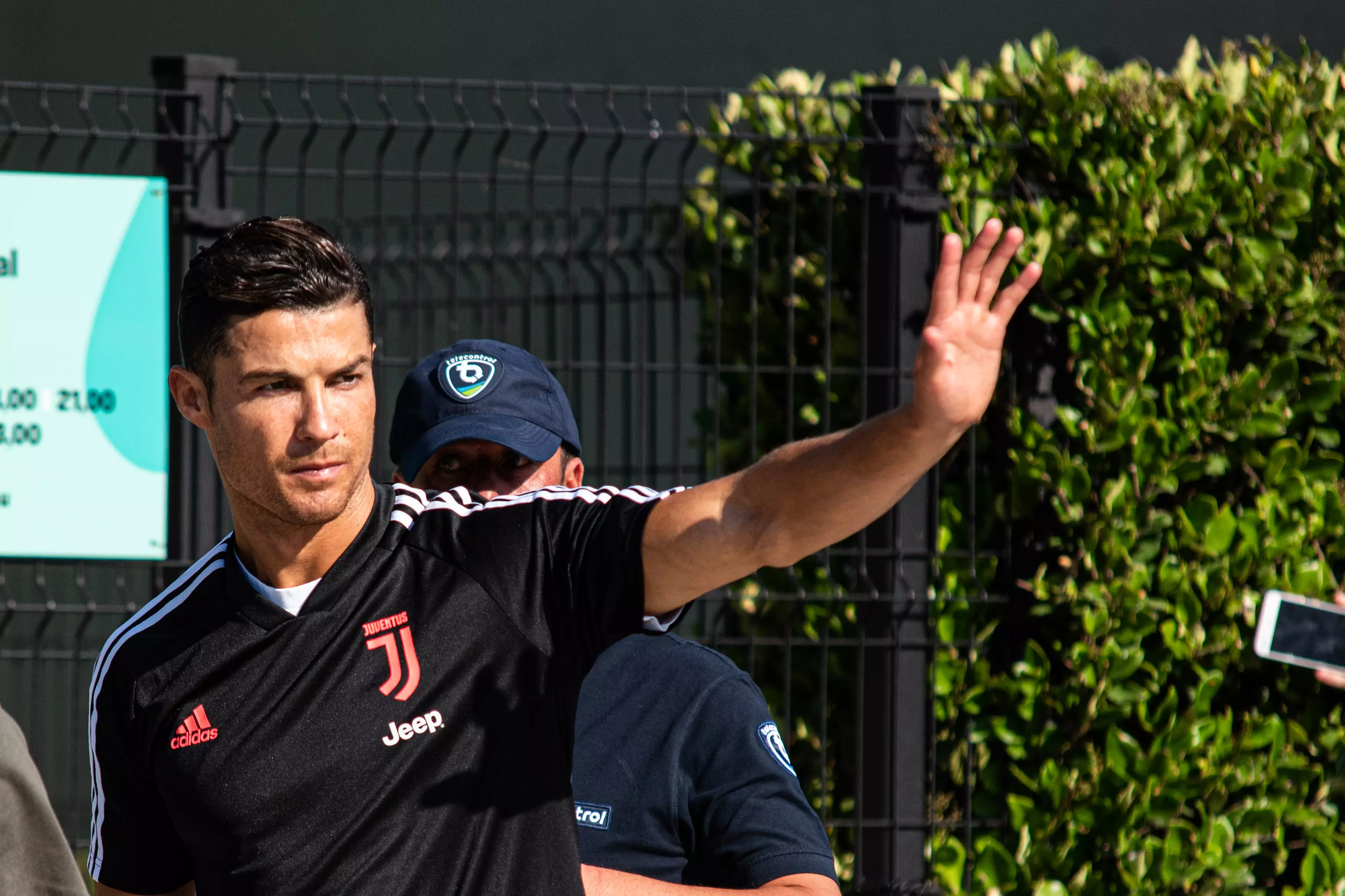 Ronaldo waves at the crowds ahead of pre season training. Image: PA Images