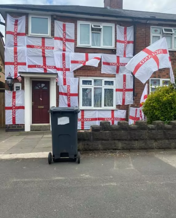 A man has been threatened after covering his home in St George flags.