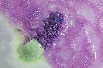 The bath bomb shoots green and blue foam from both ends. (