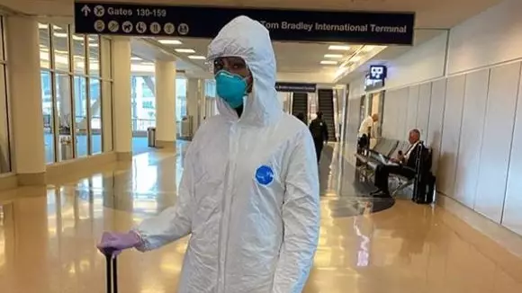 Naomi Campbell Wears Full Hazmat Suit And Mask To The Airport