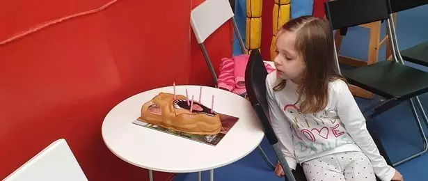 Remi with her birthday cake.