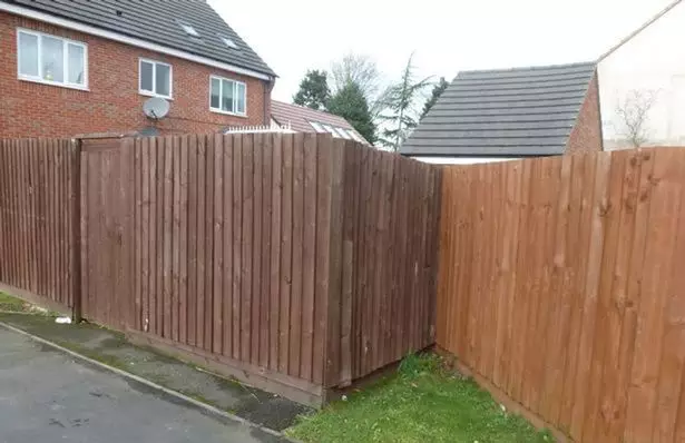 The fence the couple used to hide their 'garage'.