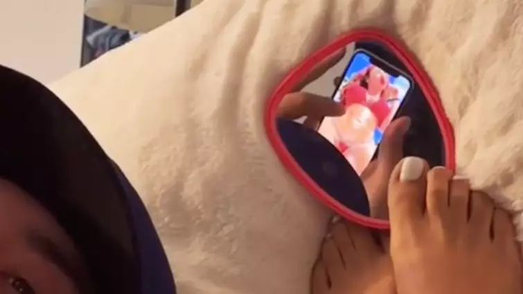 Woman Uses Sneaky Mirror To Catch Boyfriend Looking At Women On Instagram