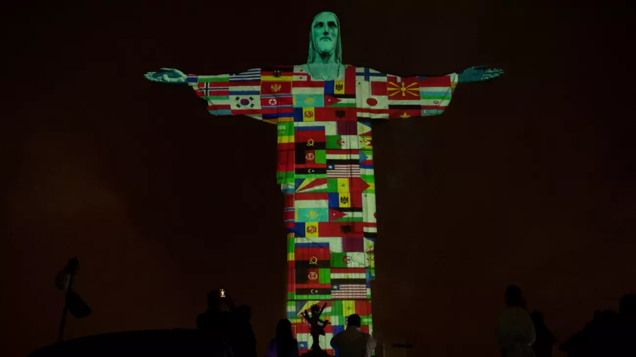 Christ The Redeemer Statue Illuminated With Flags Of Coronavirus-Hit Countries