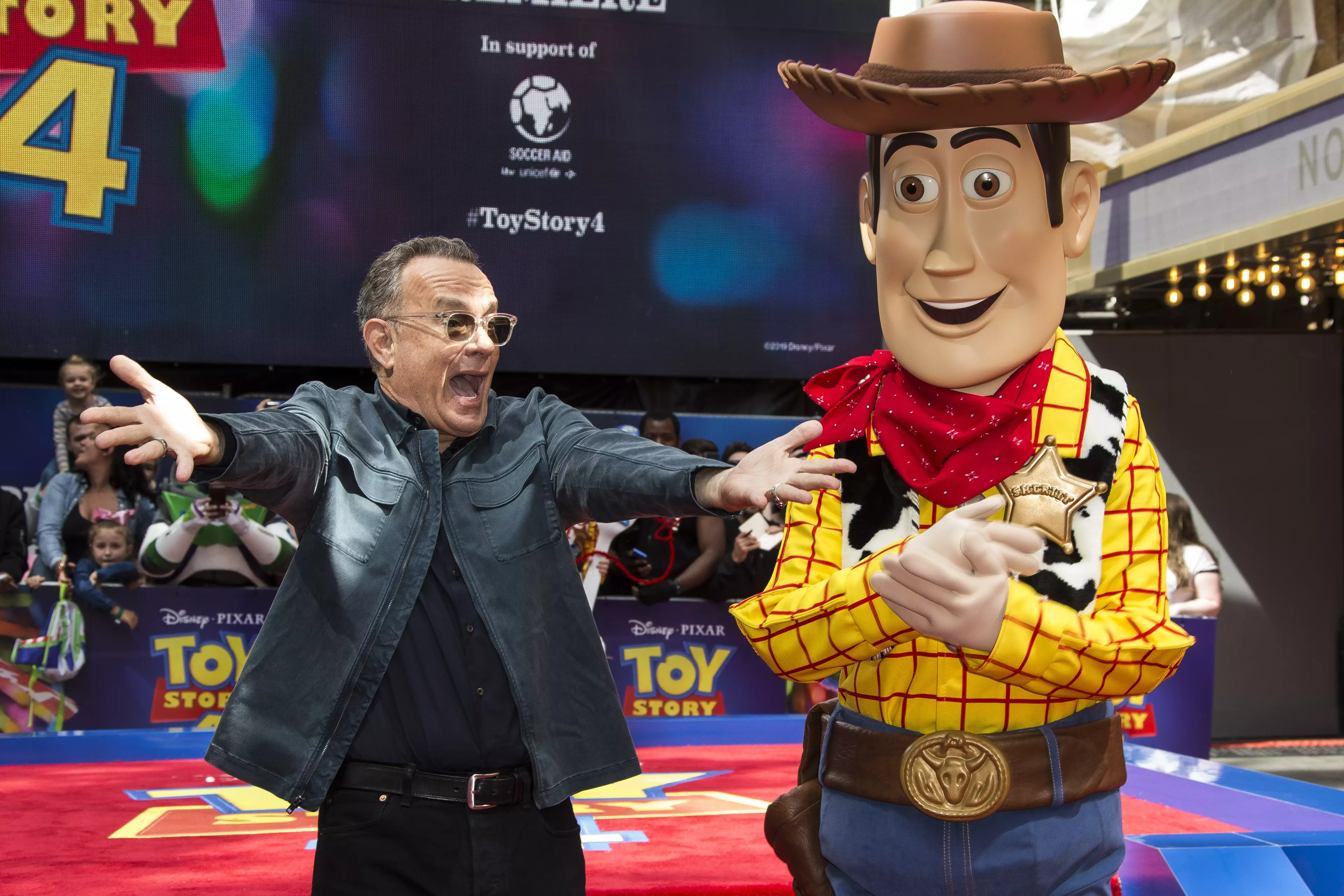Hanks alongside his character, Woody.