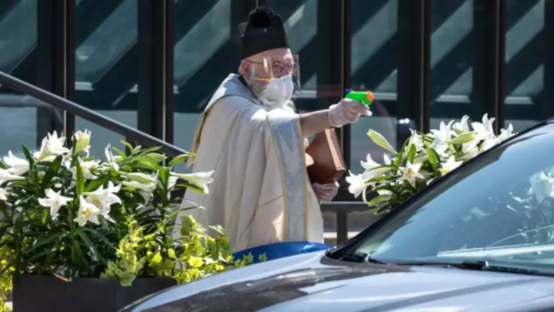Priest Goes Viral After Photographed Blessing Parishioners With Water Pistol Full Of Holy Water