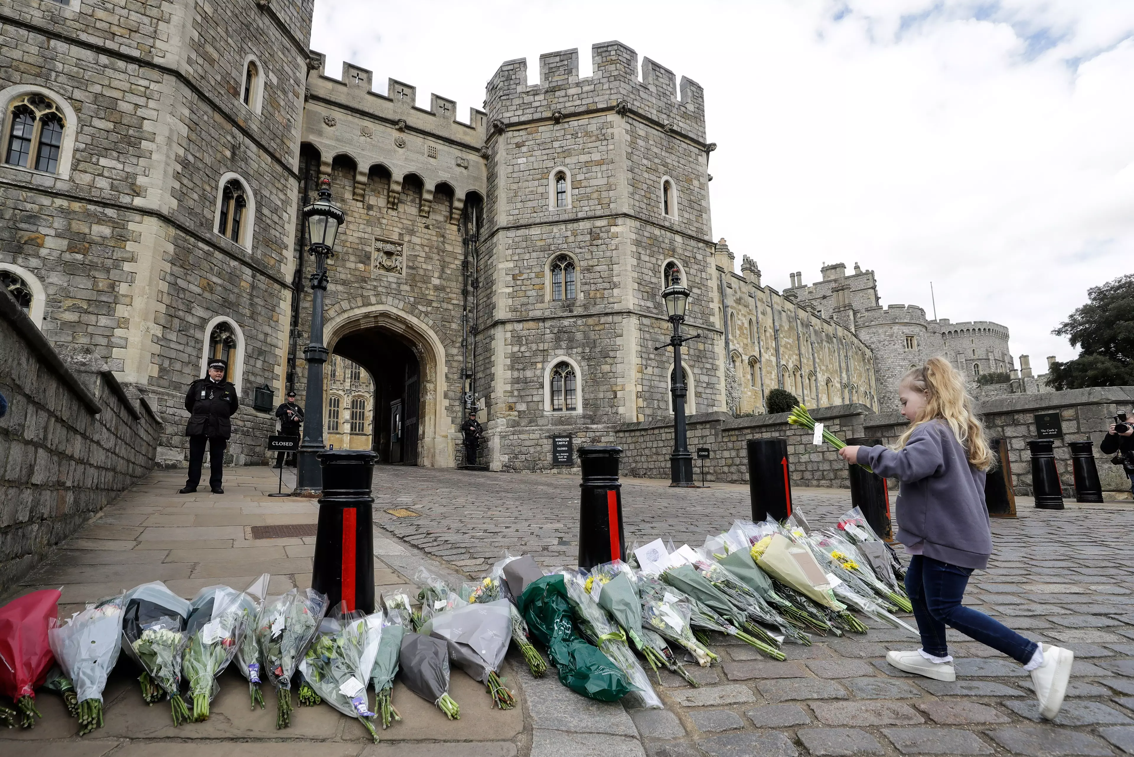 Flowers have been left by the public outside Windsor Castle in tribute to Prince Philip (
