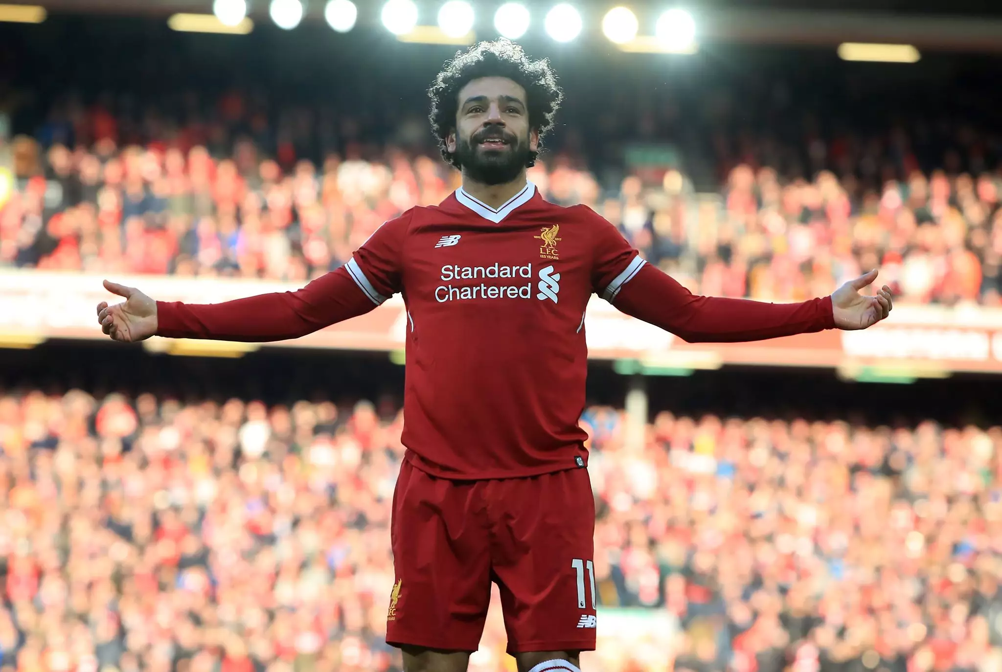 Salah gestures to the Anfield crowd. Image: PA
