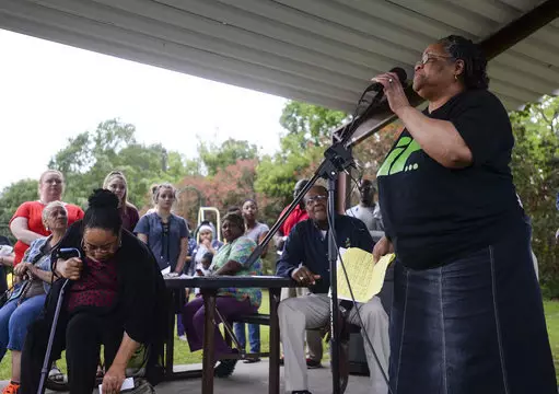 Betty Boatner, a sister of James Byrd Jr., talks to the crowd during a prayer vigil at James Byrd Memorial Park in Jasper, Texas, yesterday.