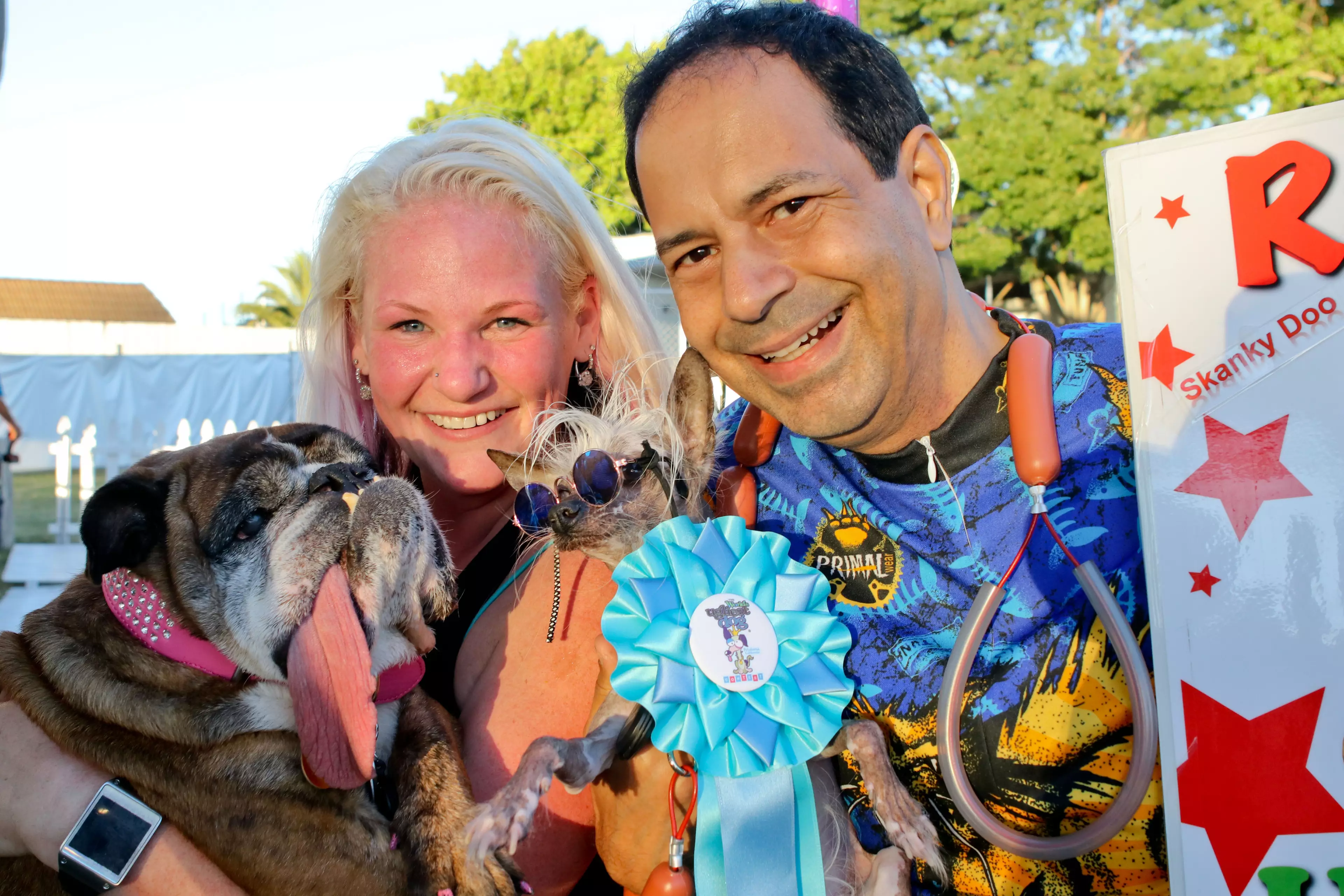 Zsa Zsa held by owner Megan. They are pictured with Rascal (six time winner), and his owner Dane Andrew.