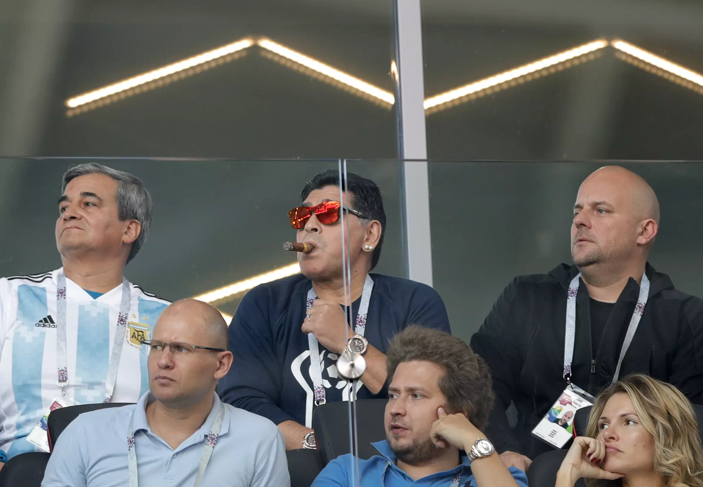 Maradona casually smoking a cigar. Image: PA