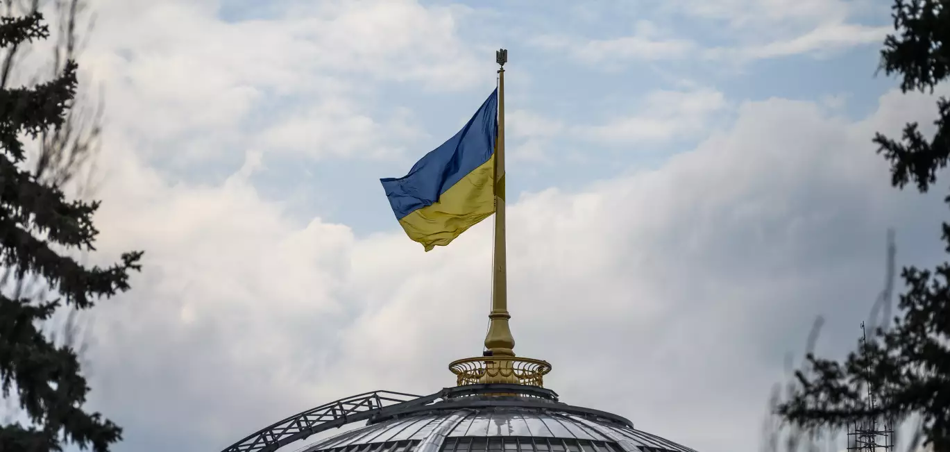 A Ukrainian flag flying above the Verkhovna Rada, Ukraine's parliament.