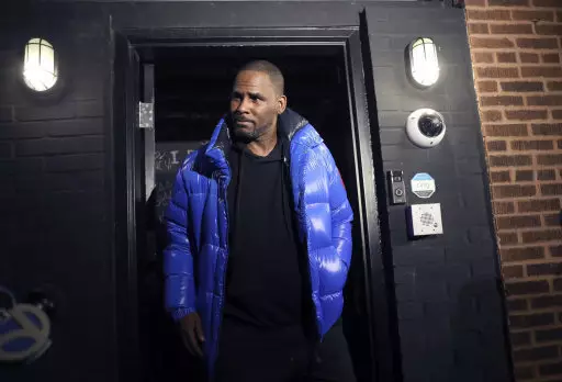 Musician R. Kelly emerges from his Chicago studio Friday night.