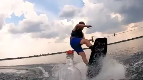 Wakeboarder Nails The Bottle Cap Challenge On The Water