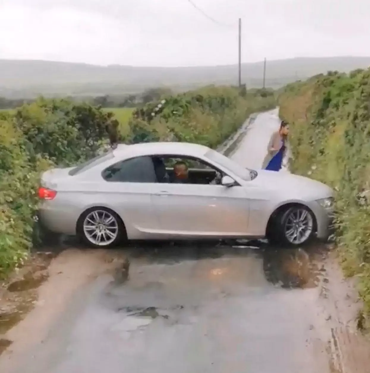 The car got stuck on a country lane in Cornwall.