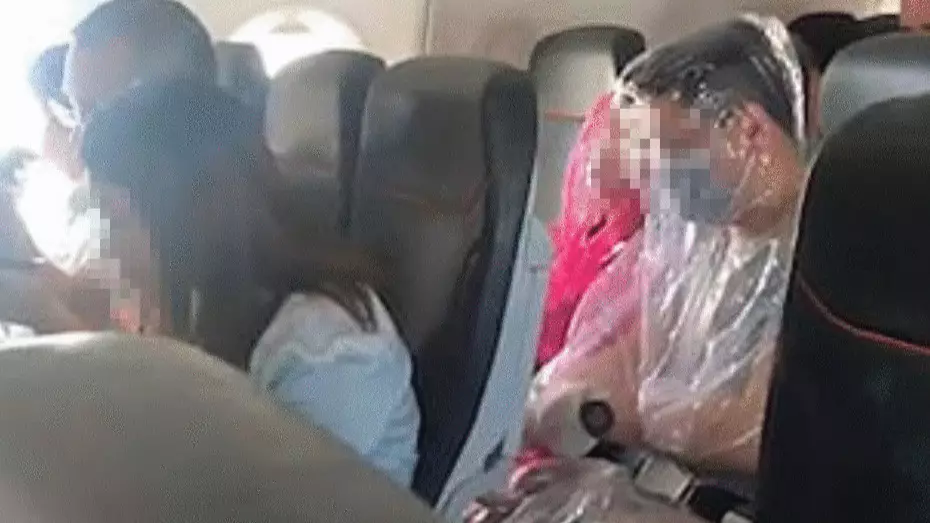 Plane Passengers Spotted Wearing Makeshift Plastic Full-Body Suits