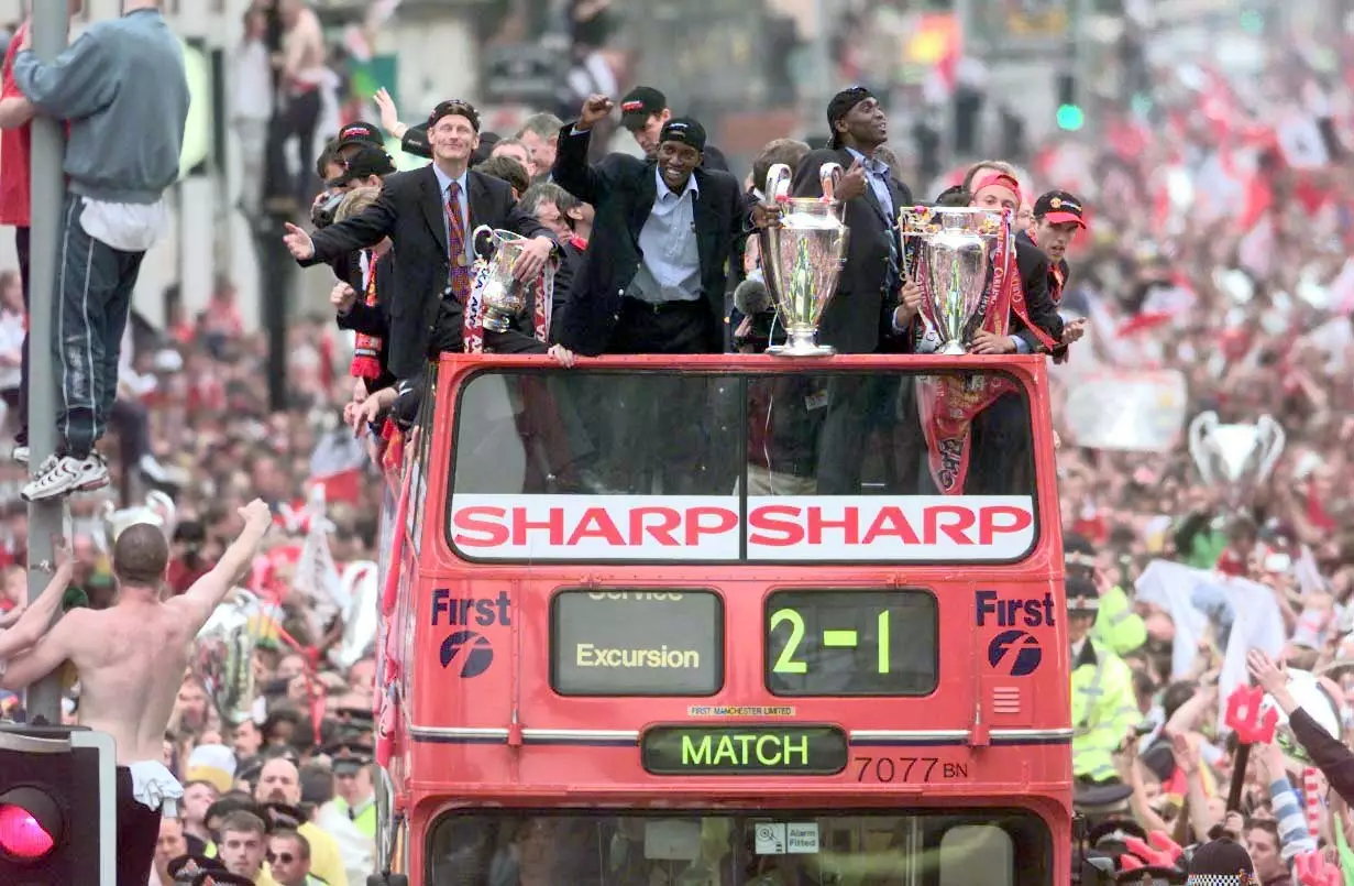 United players with all three trophies at the celebration parade. Image: PA Images