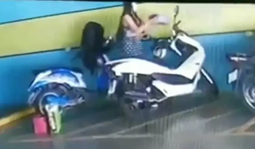 She could be seen dousing the motorbike in petrol in CCTV footage.
