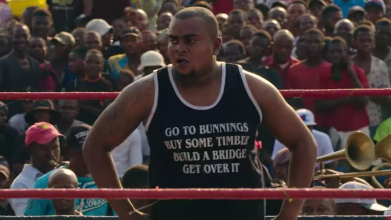 Man Spotted On Netflix Documentary About Wrestling In The Congo Has The Best Singlet 