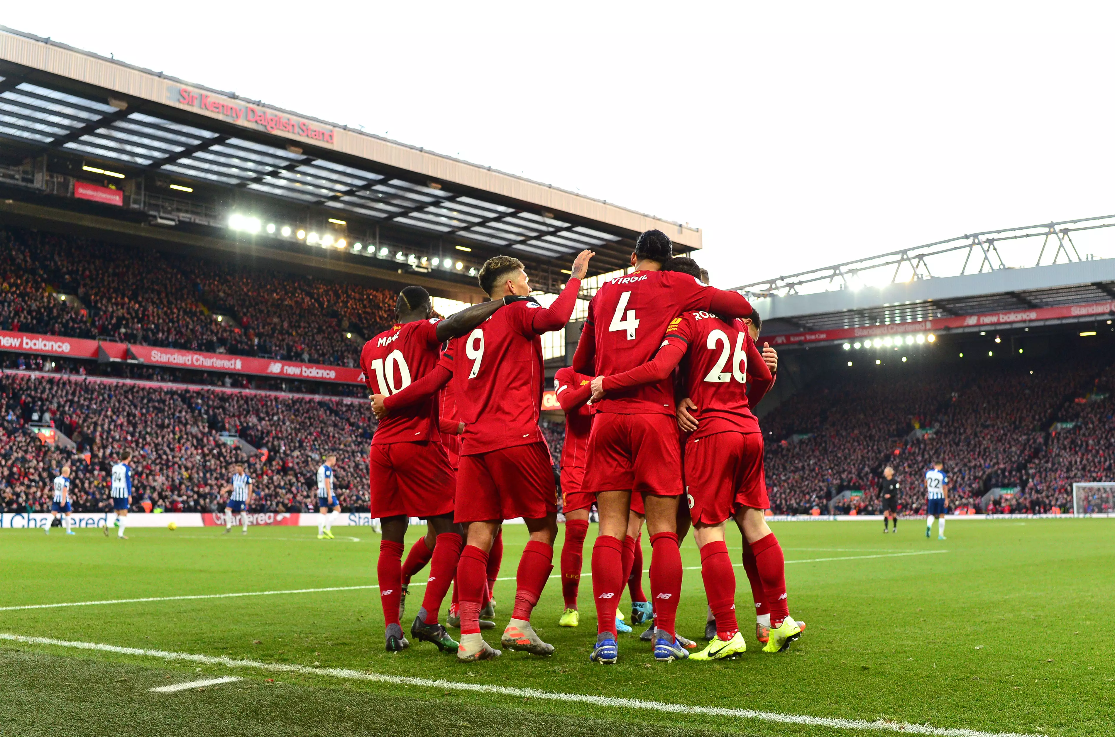 Liverpool's Virgil van Dijk celebrates scoring his second sides goal with teammates during the Premier League match at Anfield in 2019.