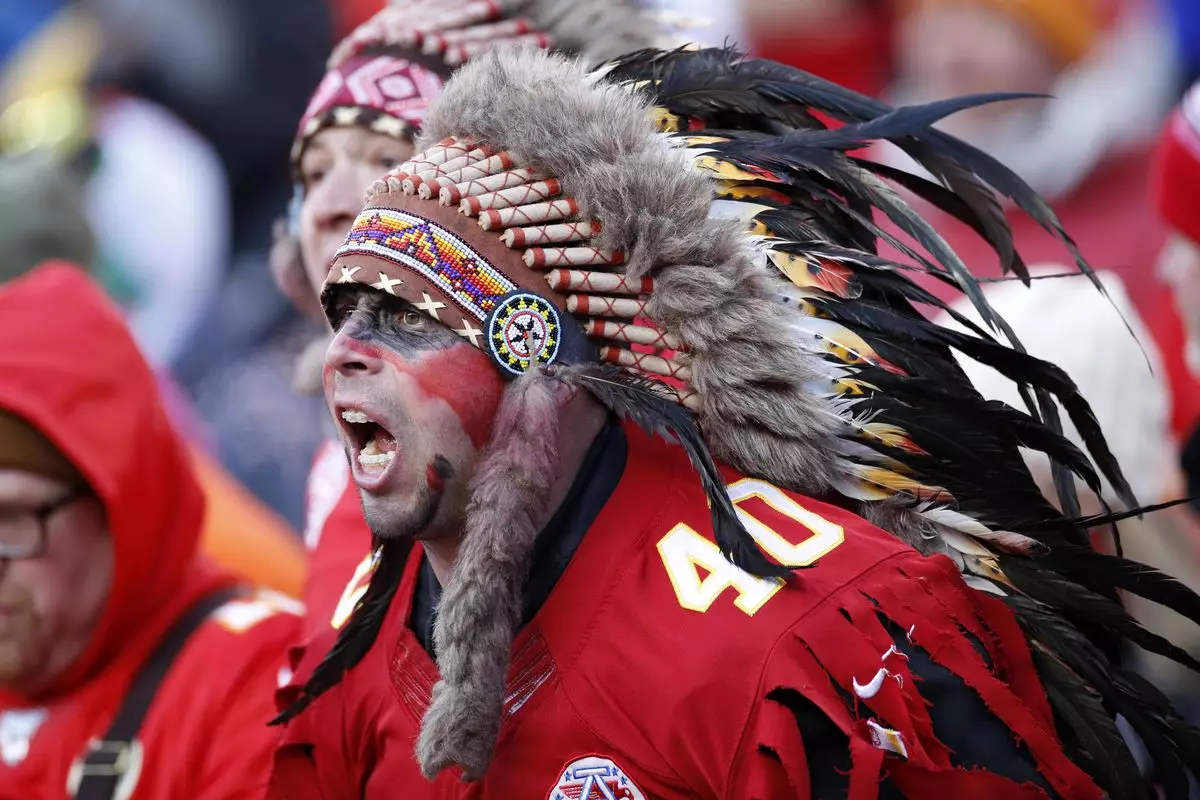 A Chiefs fans wearing a traditional Native-American headdress.