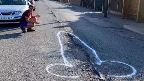 A Mystery Graffiti Artist Has Been Spray-Painting Penises Around Potholes In Essex