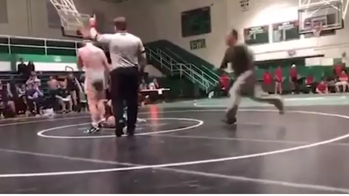 Dad Tackles Son's Wrestling Opponent To The Floor After 'Illegal' Move