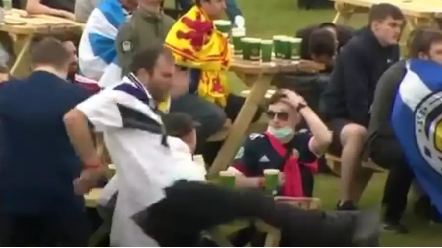 ​Scottish Football Fan Goes To Kick Table And Completely Misses After Losing Game