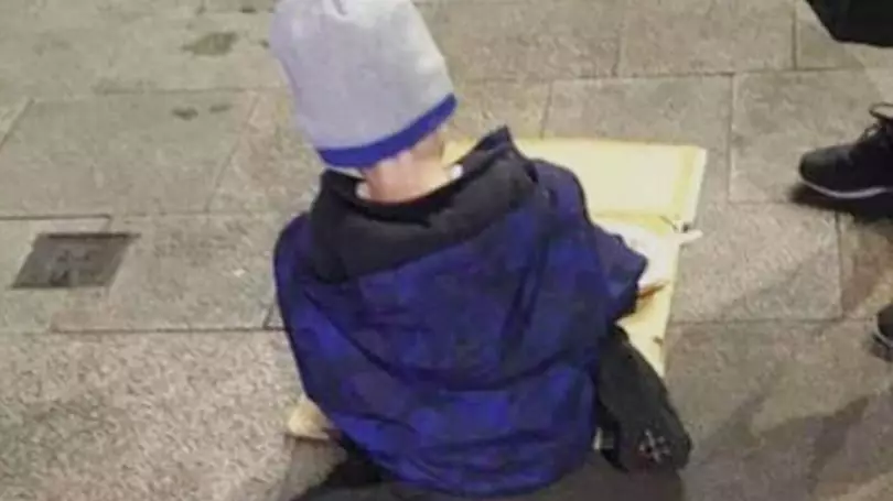 Tragic Photo Shows Homeless Boy Eating Dinner Off Piece Of Cardboard