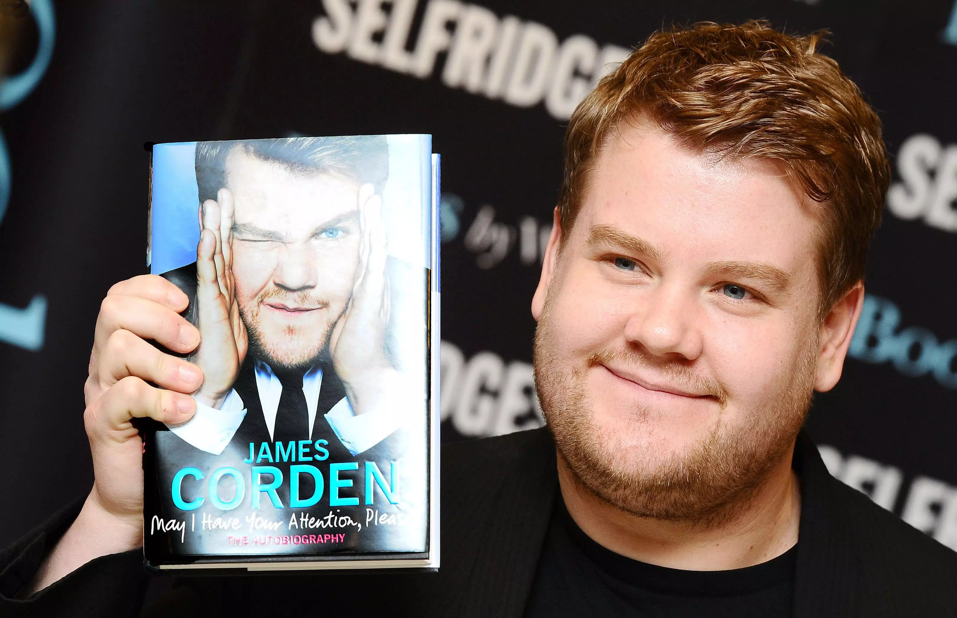 James Corden with his understated autobiography.