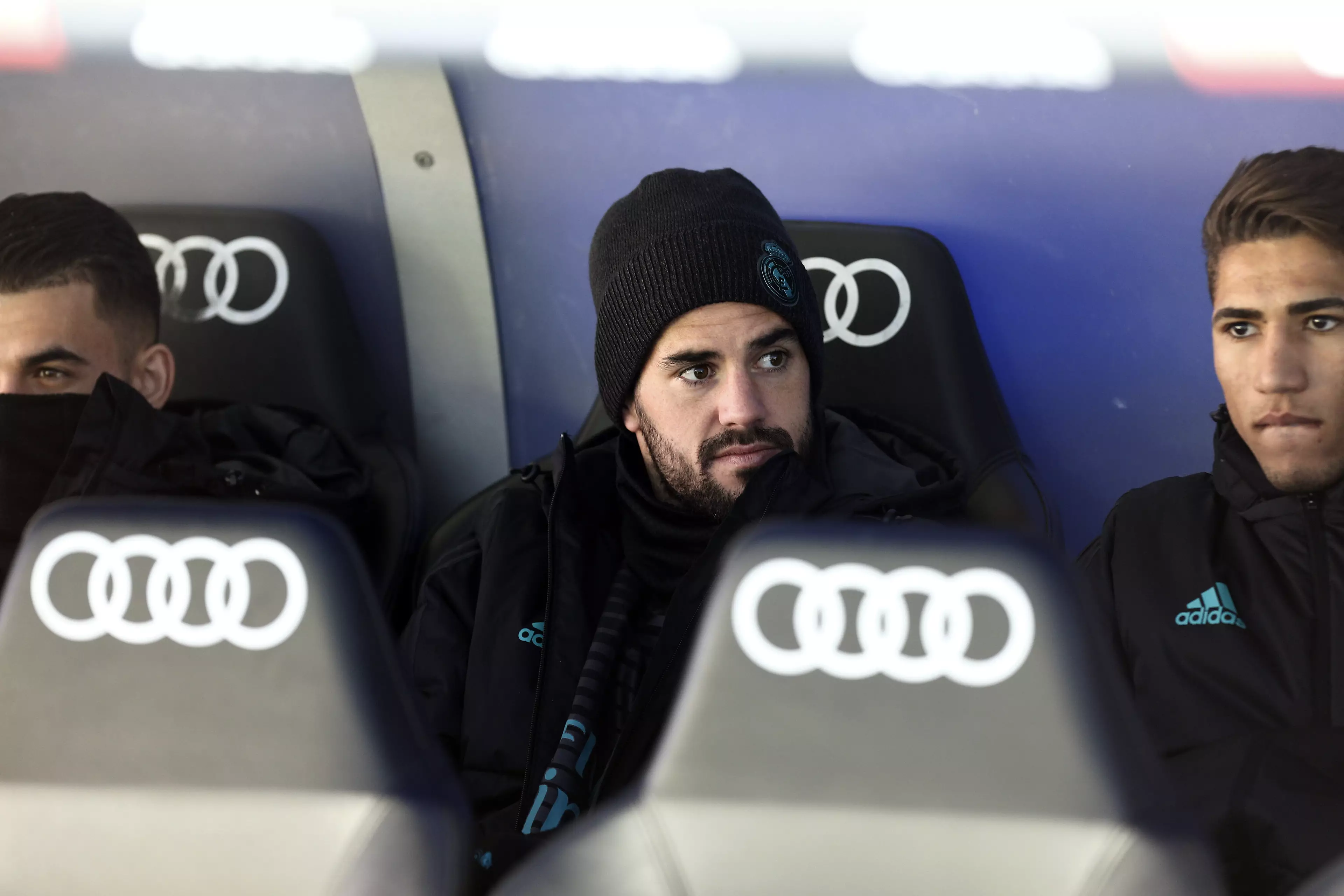 Isco watches on from the Real Madrid bench. Image: PA