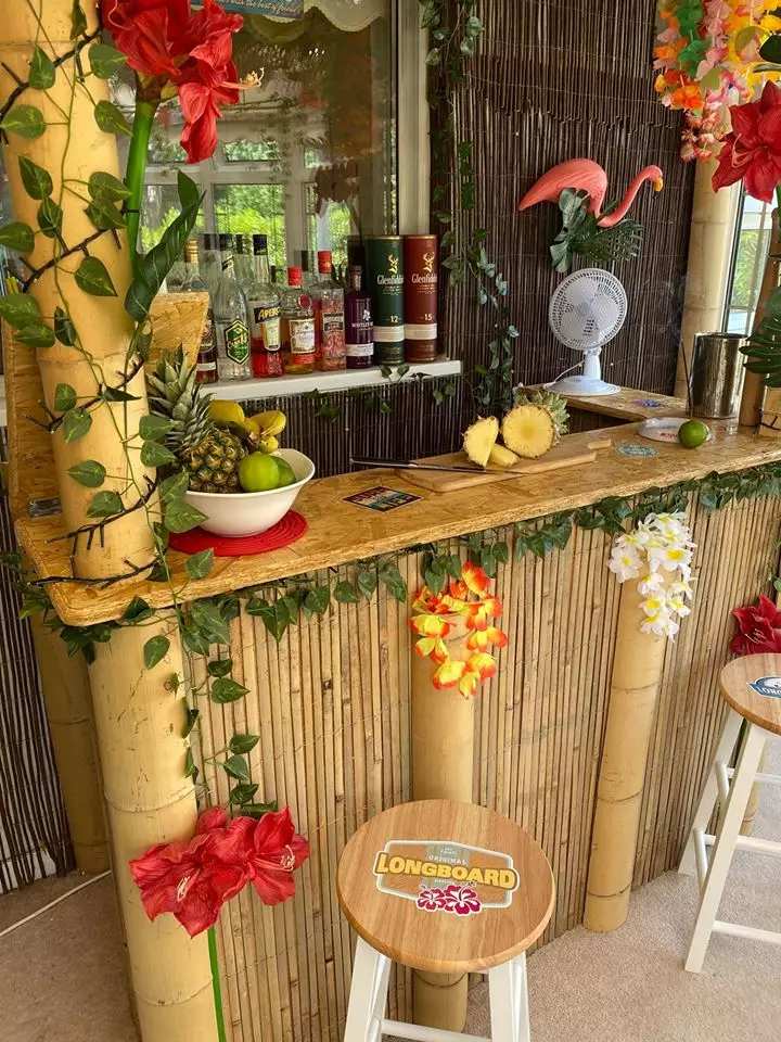 The creation is decked out with a bamboo lined bar, inflatable flamingos and fairy lights (
