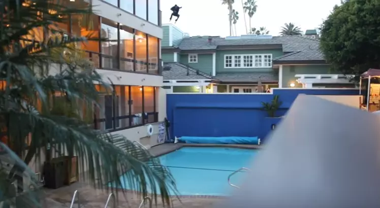 Daredevil Attempts Jump From Roof Into Pool And Misses