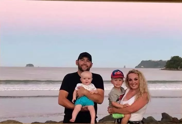 Russell, his wife Beth, and their two kids.