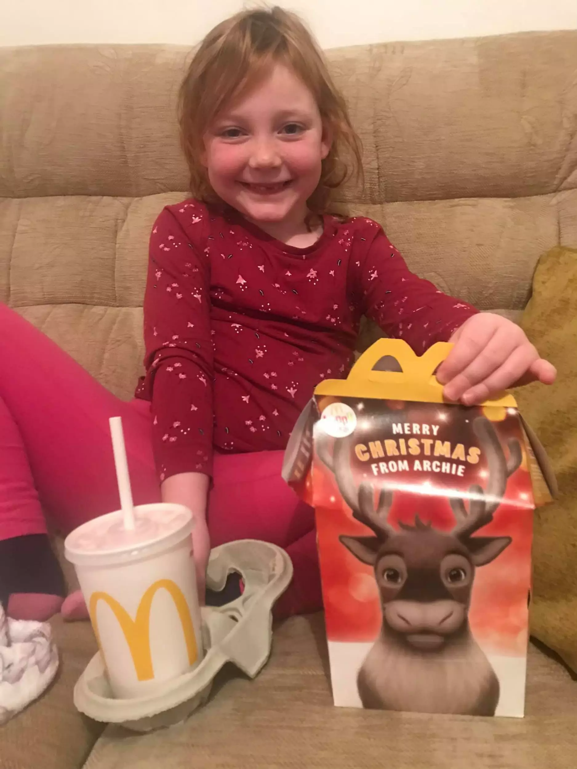 Chloe is clearly delighted with her Happy Meal.